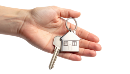 Hand Holding Three House Keys Isolated on White Background