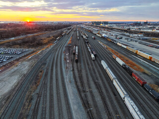 Aerial View of a Large Train Yard at Sunset
