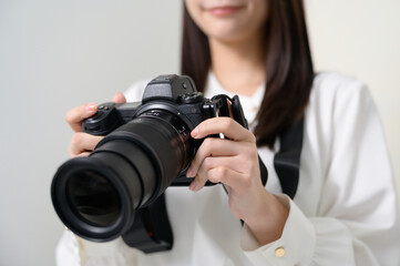 A Japanese woman holding a camera