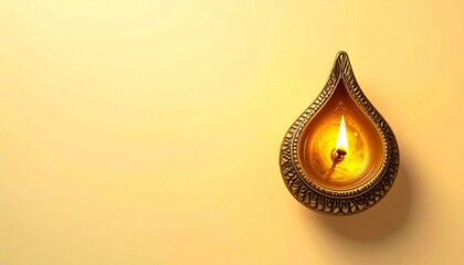 Top view of antique Brass Diya oil Lamp on yellow background.