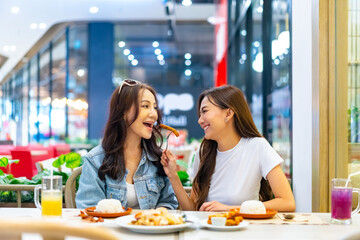 Family relationship, mother's day. Happy Asian mother and adult daughter enjoy outdoor lifestyle...