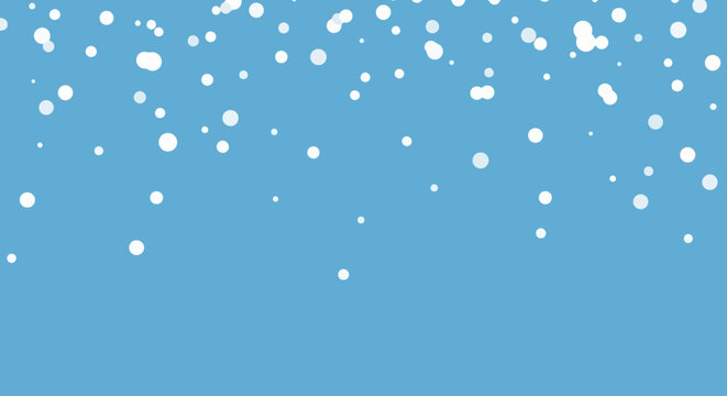 Abstract winter background with white snow dots falling against a light blue sky.