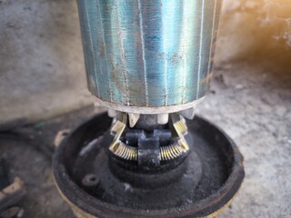 Close up the part of rotor with centrifugal switch on the electrical motor component.