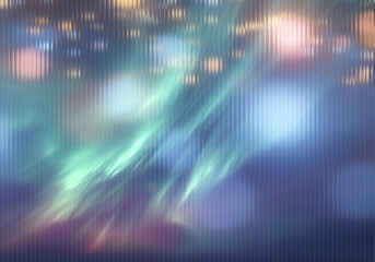 Abstract blurred background with vertical lines and soft colors creating a dreamy atmosphere