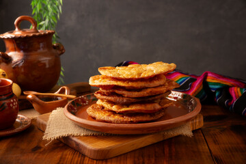 Mexican Buñuelos. Traditional food at Christmas and winter holidays in Mexico, these are fried flour tortillas sprinkled with sugar or covered in a syrup made with piloncillo, cinnamon, and guava.