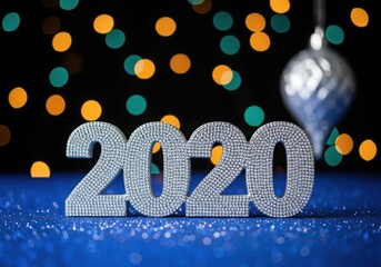 Sparkling 2020 numbers with festive bokeh lights and ornament