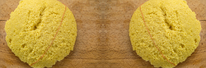 Hot steaming polenta on a old wooden board