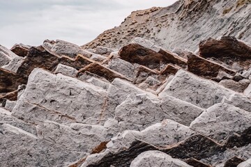 Layered Sedimentary Rock Formation With Geological Strata and Natural Erosion Patterns