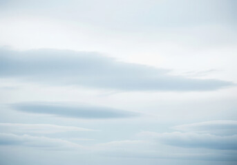 Abstract watercolor painting with soft blended washes of sky blue and white painterly textures