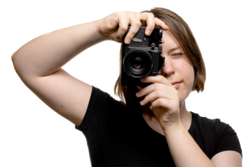 Cheerful young woman holding camera and taking a picture, isolated on transparent background.