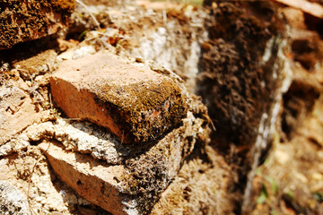 Close up ancient brick ruins of the temple in Thailand