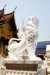 Obraz premium Plaster sculptures of lions is animals from literature decorate the cement fence in ancient pagoda of buddhism at Wat Den Sali Si Mueang Kaen temple in Chiang Mai Province in Thailand
