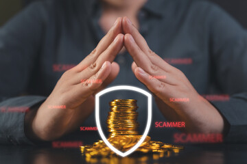 Hands shielding gold coins with a security shield against scammers, concept of financial protection, cybersecurity, and anti fraud safety