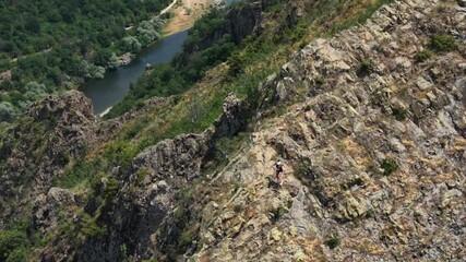 Aerial view of ultra runners descending a mountain.