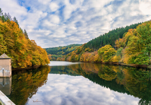 Water held in the Dhrontalsperre, a dam in Germany that provides water for the Kleine Dhron river and generates hydroelectric power. Autumn season. Germany