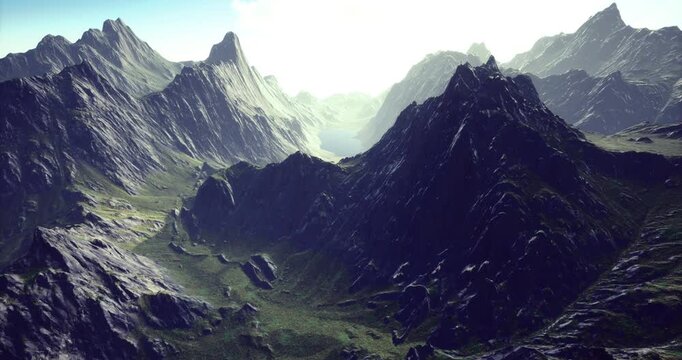 Dramatic mountain ranges stretch across a vibrant landscape as morning light floods the valleys, revealing lush greenery and rugged terrain. A breathtaking view of natures beauty unfolds.