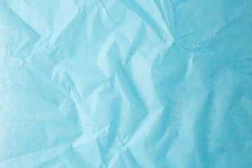 wrinkled blue sheet of paper with pastel tone and flat texture top view ideal for background layout packaging design branding presentation craft project mockup or artistic visual material use