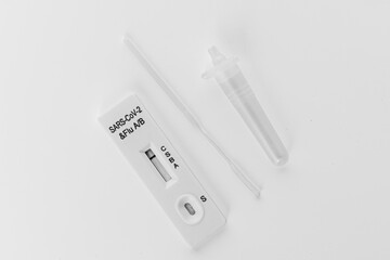Rapid Testing Kit for SARS-CoV-2 and Flu on white background