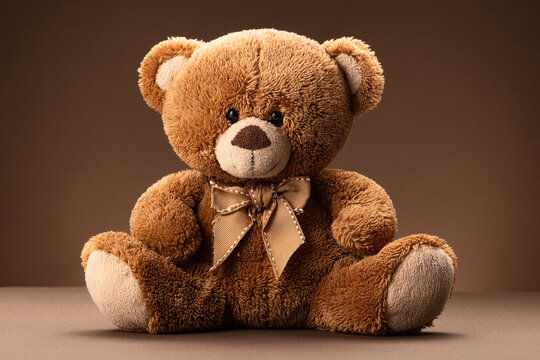Pink teddy bear plush toy for kids isolated on brown background - Powered by Adobe