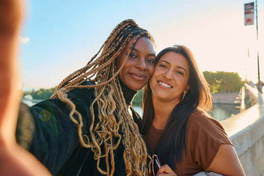 Diverse women friends taking selfie in toulouse