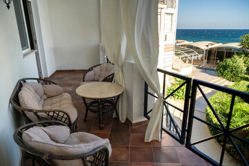 Recreation area at a country house, lounge chairs, and a hammock. Free time, relaxing, vacation at the holiday home.