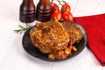 Italian cuisine - ossobuco with sauce