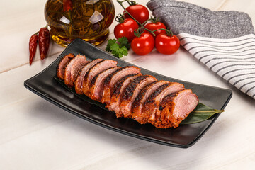 Sliced duck breast baked with cherry