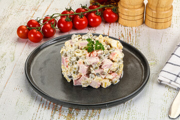 Russian traditional Olivier salad with sausages