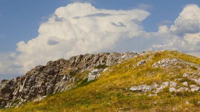 gress mount slope under a dense cloudy sky time lapse scene