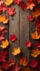 autumn leaves on wooden background