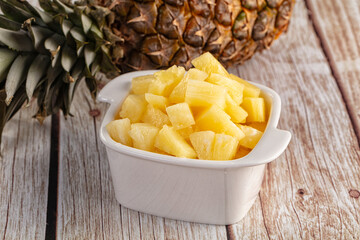 Sweet canned pineapple fruit pieces