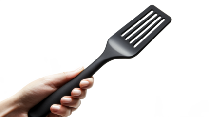 hand holding a black spatula 