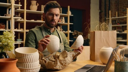 Upset serious Caucasian man male guy businessman small business owner seller potter ceramist...