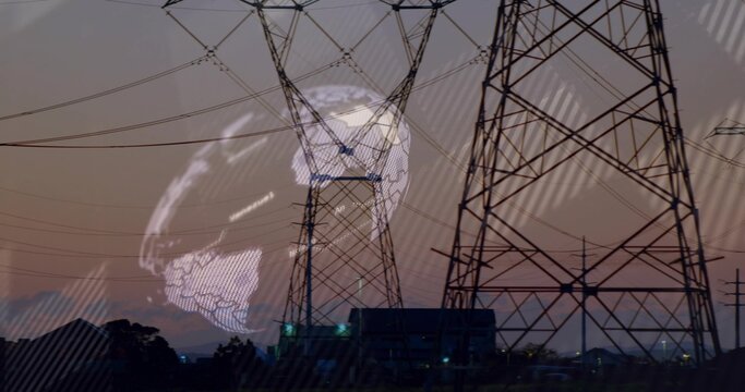 Silhouetting towers and high-voltage lines at power station, lit building and globe overlay
