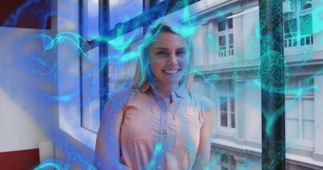 Smiling woman wearing peach top by office window near red windowsill as blue-green overlay swirling