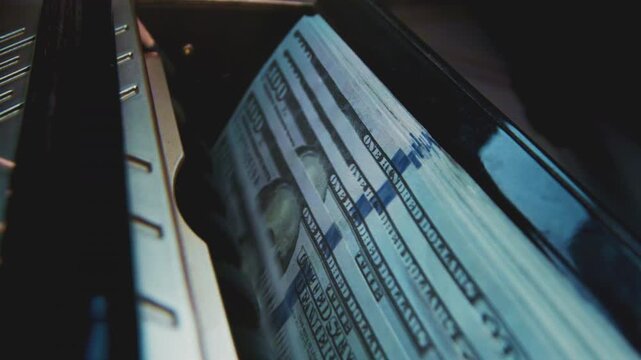 Money cash counting equipment machine. Quick credit or loan, mortgage. Payment and calculation finances. Close-up view of money counter with cash. Banking, investment and currency exchange concept.