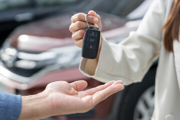 lease, rental car, sell, buy. Dealership manager send car keys to the new owner. Sales, loan credit...