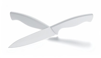 Two white knives crossed on white. Clean sharp modern look
