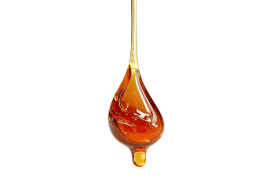 Dripping golden viscous fluid suspended, against a black backdrop
