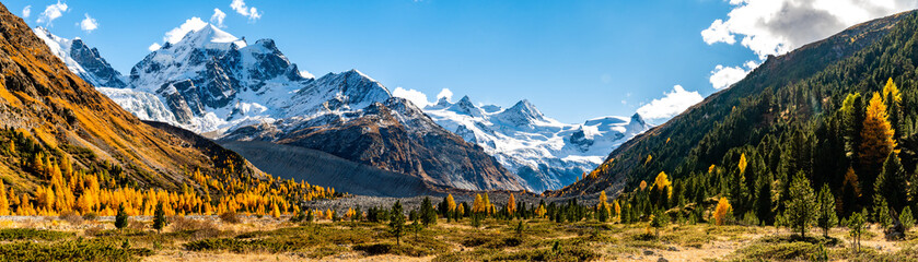 Autumnal view of the Roseg Valley, Switzerland, with trees and autumn colors.