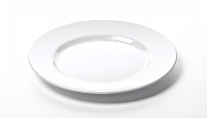 Empty white plate on a white surface with soft shadows