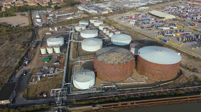 Aerial view of an industrial landscape featuring various tanks and pipelines, creating a complex network of infrastructure, Purfleet-on-Thames, England, United Kingdom.