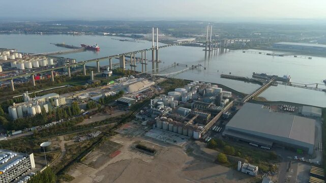 Aerial view of the industrial area near the bridge over the water, showcasing a blend of infrastructure and natural elements, Purfleet-on-Thames, England, United Kingdom.