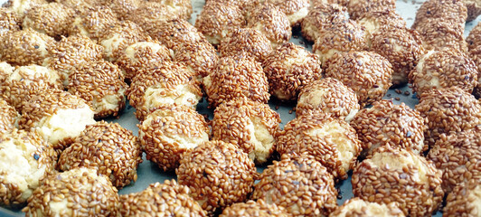 cookies with sesame seeds on a wooden table
