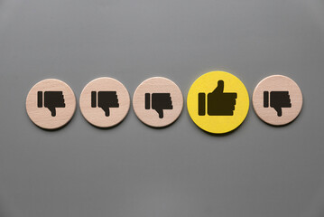 Positive Feedback Standing Out: Contrasting Like Symbol Among Dislike Icons on Neutral Background Representing Unique Opinion or Excellent Rating