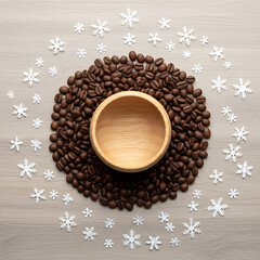 Festive coffee beans with wooden bowl and snowflake decorations winter theme