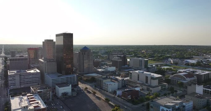 Aerial view of Dayton's skyline with its mix of modern skyscrapers and historic buildings under the warm glow of sunrise, Dayton, Ohio, United States.