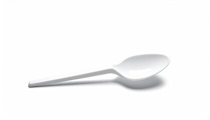 White plastic spoon, simple curved design, cast shadow