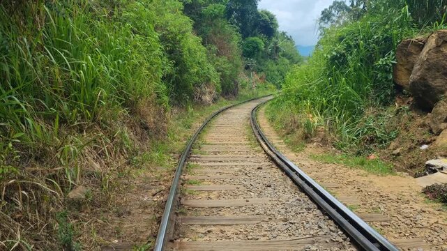 A revealing view of the empty Badulla&ndash;Colombo railway near Ella, Sri Lanka, as it winds through misty highlands and dense tropical jungle