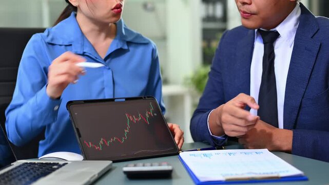 Two stock traiders making analysis of digital market and investment in block chain crypto currency. Stock trade concept